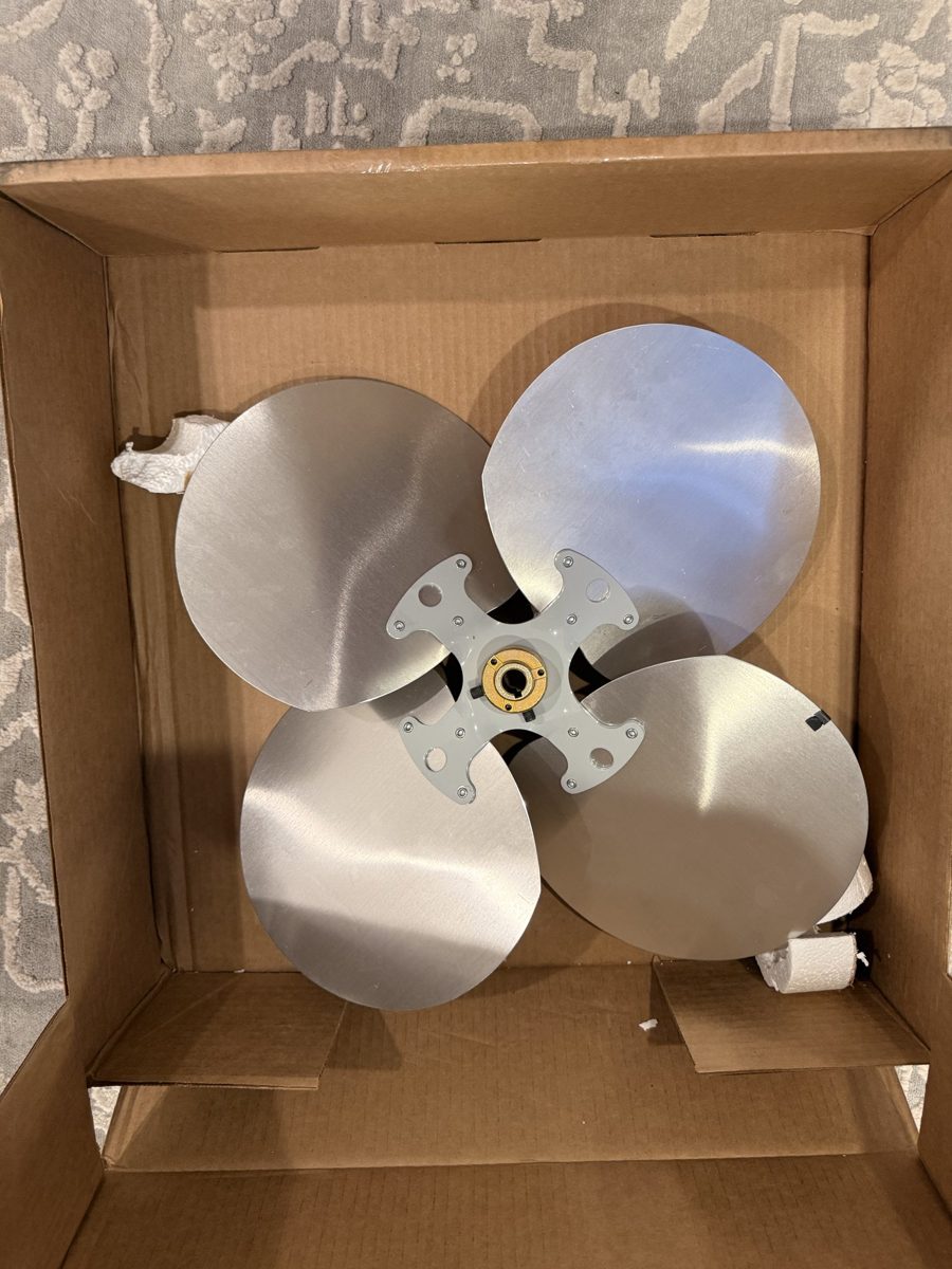 LAU 60263801 20-inch 4-blade fan blade in its box, showing the installed 5/8-inch keyed hub